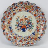 A large Japanese Imari plate, Meiji period (1868 - 1912). Scalloped design radiating from the