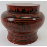 A large Indo Persian red lacquered covered pot. Of baluster form with black hand painted decoration.