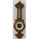 An aneroid barometer, 19th century. Incorporated with a mercury thermometer and inset bevelled glass