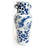 A Chinese blue and white porcelain twin handled vase, 19th century. The twin handles with blossoming