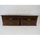 An Edwardian nest of drawers. Mahogany with satin wood banding and foliate brass handles. (2