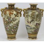 A pair of Japanese Satsuma twin handled vases, Meiji period (1868 - 1912). With finely painted and