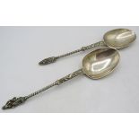 A pair of Hanau pseudo silver marked apostle serving spoons, approx weight 3.2 troy oz/104 grams.