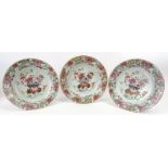 Three Chinese famille rose plates, 18th century, Qianlong period. Each profusely decorated with