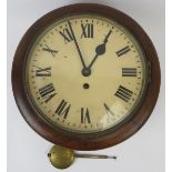 A mahogany wall clock, early 20th century. Of circular form with a mahogany case and enamelled Roman