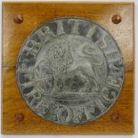 A rare British Fire Office metal plaque. Cast in lead depicting a lion beside a United Kingdom