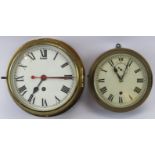 Two brass wall clocks. Comprising a ship’s bulkhead clock together with another wall clock of