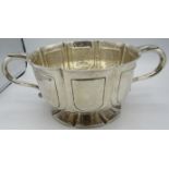 A good Arts & Crafts silver two handled bowl on a splayed pedestal foot. Engraved 'New Square,