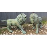 A pair of fantastic bronze Verdigris patinated near life size models of roaring lions, 20th century.