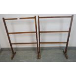 A pair of Edwardian mahogany towel rails on splayed supports. H90cm W61cm D24cm (approx).