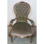 A Victorian mahogany show-wood open-sided armchair, the carved frame with scrolled and acanthus leaf