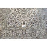 A fine Kashan carpet, even floral pattern on cream ground and in good condition. 305cm x 200cm (