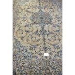 A good Persian Kashan carpet, pale blue ground central motif with scrolls. 354cm x 245cm (approx).