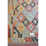 Anatolian Turkish Kilim rug. In very good condition. Colourful diamond motif pattern and good
