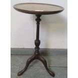 A small mahogany Regency Revival wine table, with batwing inlay, on a turned column with splayed