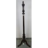 An Edwardian mahogany standard lamp with carved and reeded column, on acanthus carved splayed tripod