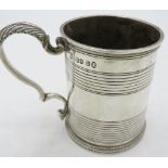 A Georgian silver christening mug with double scroll acanthus leaf handle, monogrammed. Approx 3"/