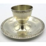 A silver egg cup on fixed stand with foliate edge design, Birmingham 1949, Goldsmiths &