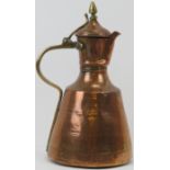 A Middle Eastern brass and copper ewer, probably 19th century. in (cm) height. Condition report: