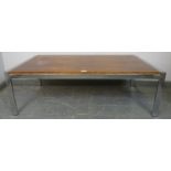 A mid-century rosewood and chrome coffee table in the manner of Merrow Associates, on chrome