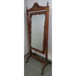 A fine 19th century French parquetry inlaid cheval mirror, with ormolu mounts and finials, on