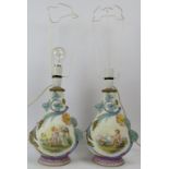 A pair of European vases. Probably Italian. Of bulbous form with hand painted decoration depicting