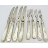 A set of four silver & mother of pearl fruit knives and forks, Sheffield 1925. Condition report: Age