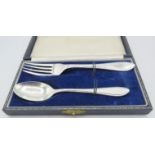 A silver christening spoon and fork, Sheffield 1957 & 1959, boxed. Approx weight 1.8 troy oz/55