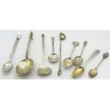 A collection of various spoons, to include a Victorian anointing spoon, London 1897, a skimming