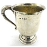 A silver Christening mug on a pedestal foot, monogrammed, Birmingham 1927, approx 3 1/2"/9cm.