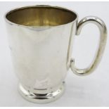 A silver christening mug with pedestal foot base, engraving on side, H.W Ltd, Birmingham 1927.