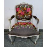 A vintage French open-sided armchair, painted distressed grey and re-upholstered in a contemporary