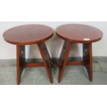 A pair of Arts & Crafts circular mahogany side tables, on canted stile supports with pierced side