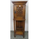 A well carved vintage medium oak cabinet in the Gothic taste, featuring linen fold panelling and