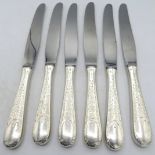 A set of six dinner knives with embossed foliate & scroll design handles, marked Birks Sterling.