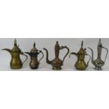 A group of five small Middle Eastern metalwork ewers. (5 items) 9.7 in (24.5 cm) tallest height.