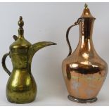 Two Middle Eastern metalwork decanters. Comprising a copper jug with hinged cover together with a