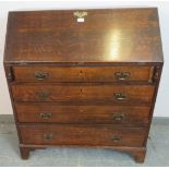 An 18th century oak bureau, the fall front opening onto a fitted interior with central document safe