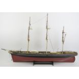 Maritime: A vintage model of the Cutty Sark clipper ship. Hand crafted and painted wood. Molded