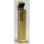 A vintage Dunhill gold plated Tallboy table lighter. Of rectangular form with a flared foot. 4.3