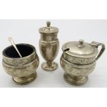 A three piece silver pedestal condiment set, Birmingham 1938, salt and mustard with blue liners