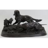 After Pierre Jules Mene: A French cast bronze pair of hunting dogs, 20th century. Modelled in a