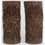 A large pair of Chinese carved bamboo brush pots. Both carved depicting immortals and attendants