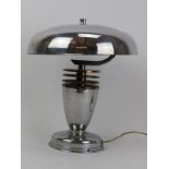 A modernism chrome and copper table lamp, circa 1930s. 10.8 in (27.5 cm) height. Condition report: