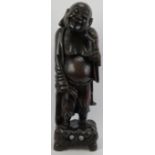 A large Chinese carved wood figure of Laughing Buddha, 20th century. 24 in (61 cm) height. Condition