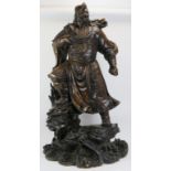A large Chinese carved wood figure of a warrior. Depicted standing above a dragon amongst clouds. 44