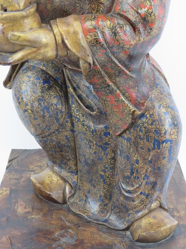 A Chinese gilt and lacquer painted carved wood figure, 20th century. Supported on a rectangular wood - Image 3 of 7