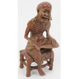 A Chinese soap stone carved figure of an old man, 20th century. 4.8 in (12.2 cm) height. Condition