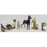 A group of British and European ceramic animal figurines, 20th century. Comprising a Royal Doulton