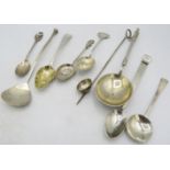 A collection of various spoons, to include a Victorian anointing spoon, London 1897, a skimming